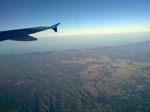 image from airplane window at height looking over Nicosia
